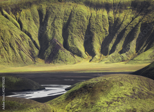 Majestic Icelandic Landscape with Lush Green Hills and Valleys photo