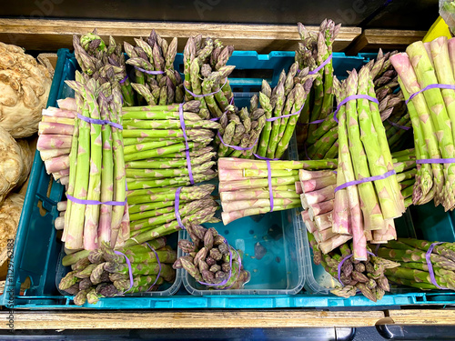 Ripe delicious Asparagus spears tied in bundles for sale in a market