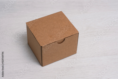 Eco friendly packaging sustainable shipping box on light background. Simple and sturdy packaging for product protection.