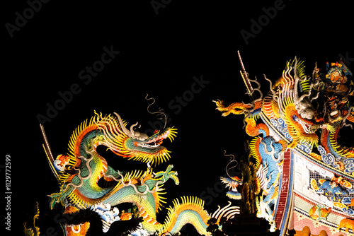 the gorgeous dragon pattern decoration shines brightly under the night sky