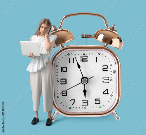 Tired young woman with lapt...