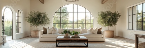 Serene Living Room With Large Arch Window and Olive Trees