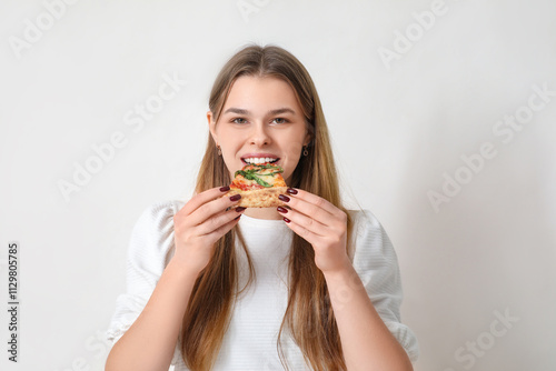 Teenage girl eating delicio...