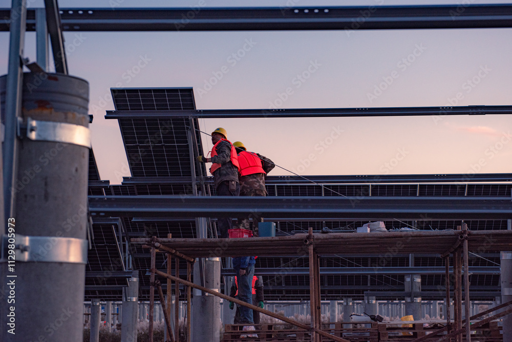 Naklejka premium Solar power plants. Sustainable renewable energy and modern photovoltaic technology are used for environmentally friendly electricity production. The concept of solar power generation.