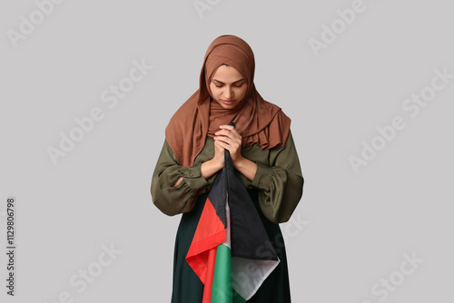 Young Muslim woman with Pal...