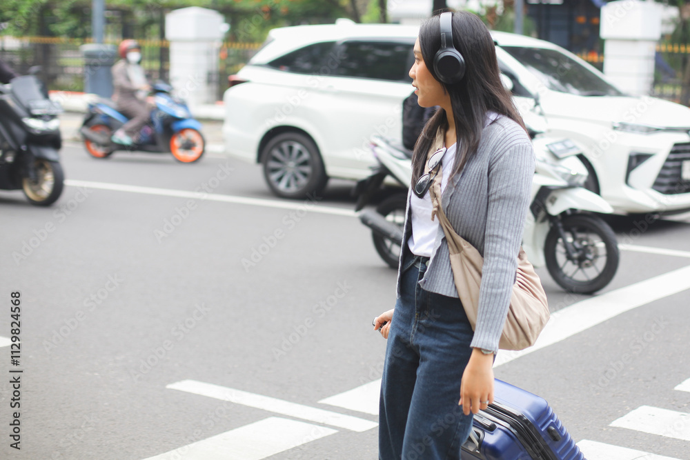 Asian Tourist Woman Walking With Suitcase on The Street Asian Tourist Woman Walking With Suitcase on The Street