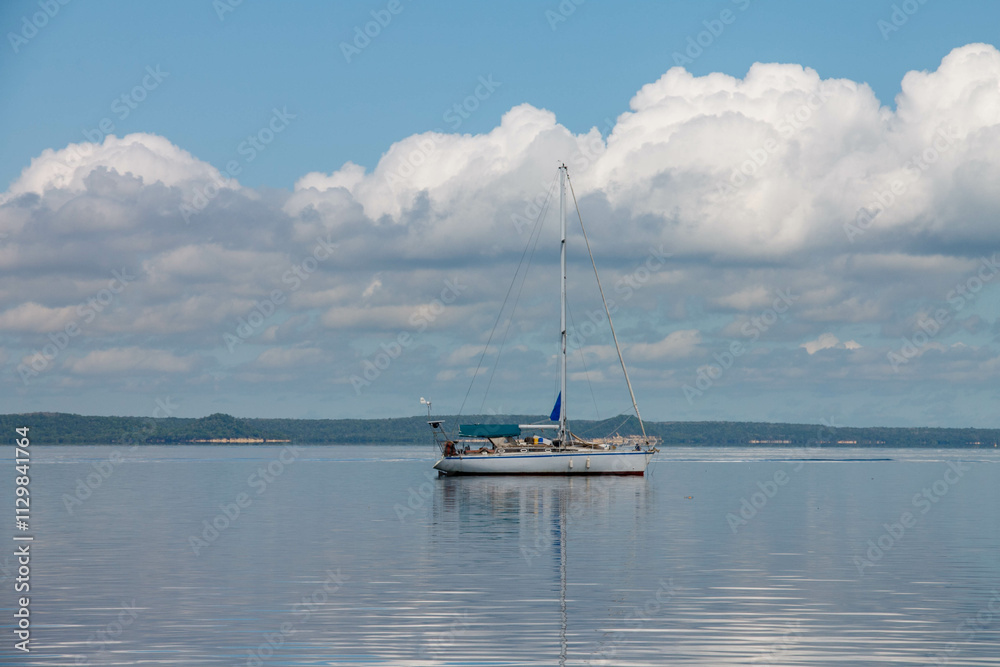 Sailboat yacht sailing in the tranquil waters of Bahia de Cienfuegos, Cuba Sailboat yacht sailing in the tranquil waters of Bahia de Cienfuegos, Cuba