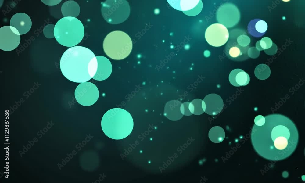 Abstract teal bokeh background with sparkling effects.