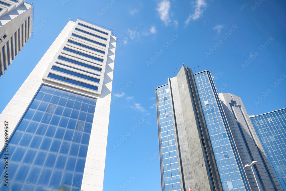 low angle view of istanbul financial bank against blue sky low angle view of istanbul financial bank against blue sky