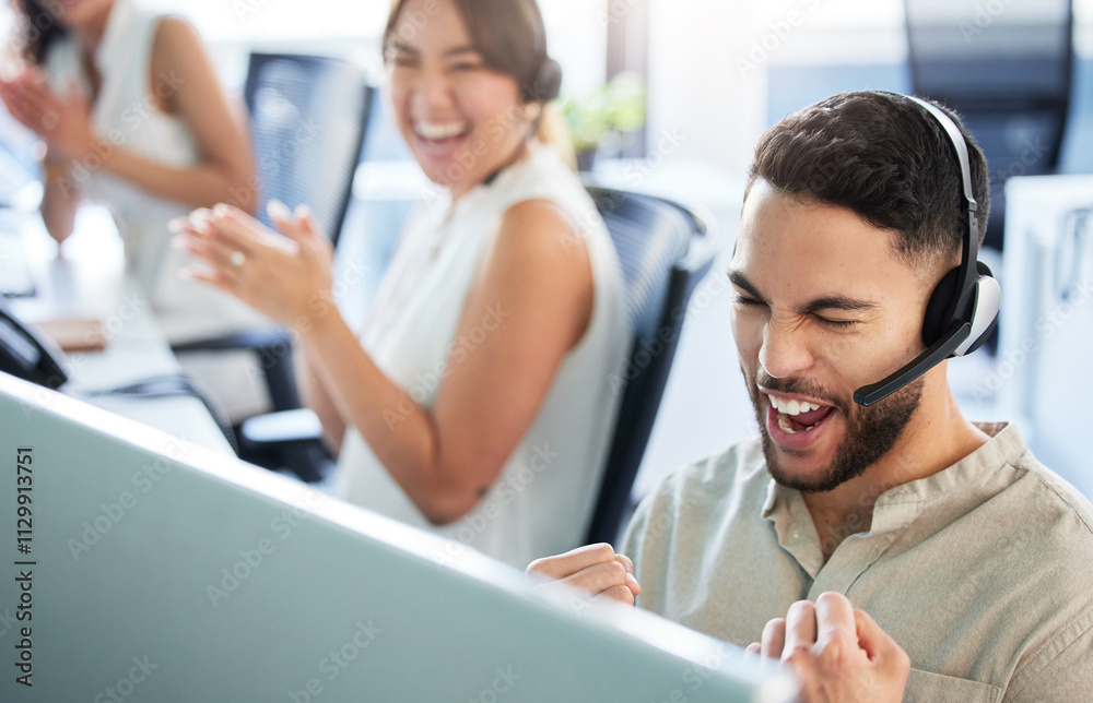 Man, call center and excited with fist on computer for reaching target, bonus and deadline. People, employees and happy with clapping hands on headset at office for celebration, victory and winning Man, call center and excited with fist on computer for reaching target, bonus and deadline. People, employees and happy with clapping hands on headset at office for celebration, victory and winning