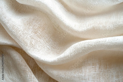 Soft and Creased Beige Fabric Draped Elegantly on a Surface