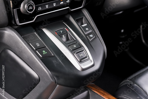 automatic transmission shift selector in the car interior. Closeup a manual shift of modern car gear shifter. 4x4 gear shift