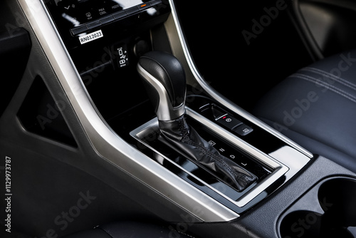 automatic transmission shift selector in the car interior. Closeup a manual shift of modern car gear shifter. 4x4 gear shift photo