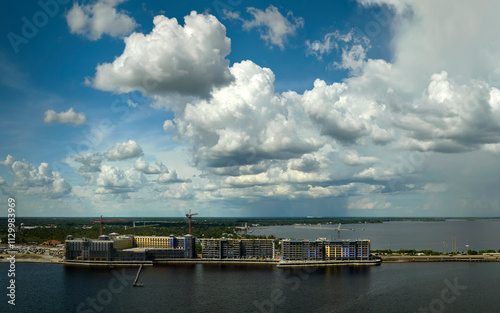 Wallpaper Mural Tower lifting cranes at high residential apartment buildings construction site at seaside. Real estate development Torontodigital.ca