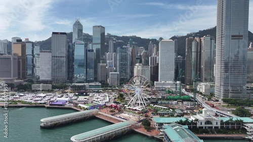 Skyview of Hong Kong Central Harbourfront surrounded by skyscrapers in the financial district. Overlooking Victoria Harbour Admiralty Wan Chai Tsim Sha Tsui West Kowloon