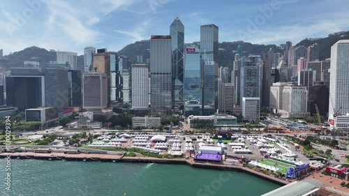 Skyview of Hong Kong Central Harbourfront surrounded by skyscrapers in the financial district. Overlooking Victoria Harbour Admiralty Wan Chai Tsim Sha Tsui West Kowloon