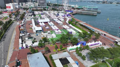 Skyview of Hong Kong Central Harbourfront surrounded by skyscrapers in the financial district. Overlooking Victoria Harbour Admiralty Wan Chai Tsim Sha Tsui West Kowloon photo