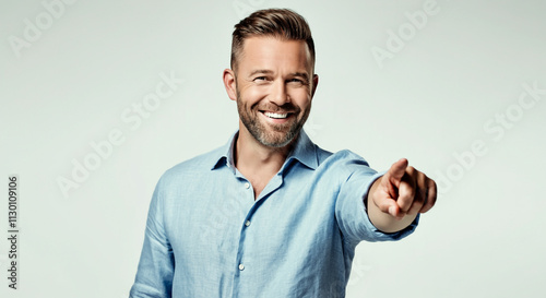 A smiling man in a light bl...