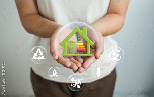 Energy-saving homes, energy efficiency concepts, eco-friendly home improvements, cost savings, low-energy eco-friendly homes, green handshake.