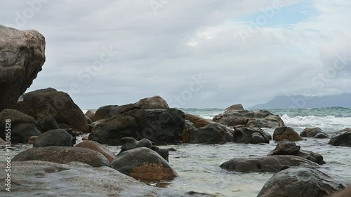 The coast of the Seychelles with huge boulders washed by the waters of the Indian Ocean, Mahe Island
