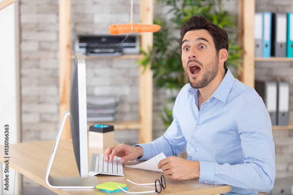 © auremar - businessman looks in wonder at dangling carrot above him © auremar - businessman looks in wonder at dangling carrot above him
