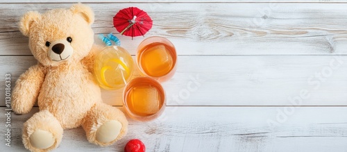 Teddy bear and colorful children's cocktails arranged on a white wooden surface creating a playful and inviting atmosphere for kids. photo