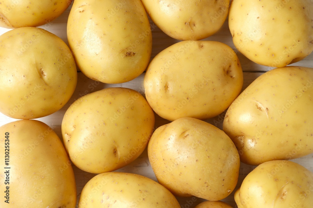 Young potatoes. Fresh potatoes on a wooden background. Harvesting collection. organic, freshly dug potatoes. Agricultural background. Vegan. Vegetables.Place for text.Copy space Young potatoes. Fresh potatoes on a wooden background. Harvesting collection. organic, freshly dug potatoes. Agricultural background. Vegan. Vegetables.Place for text.Copy space