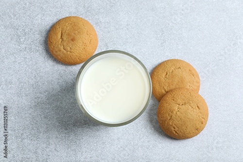 Glass of milk with cookies on the table photo