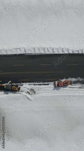 Snowplows Working on the Road photo