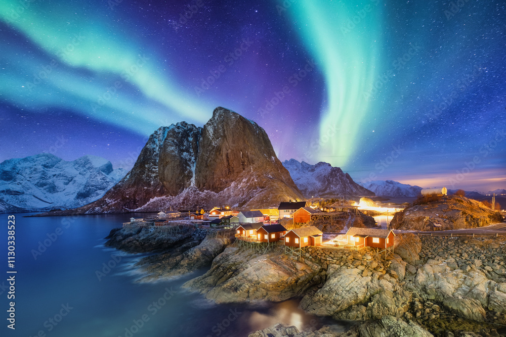 Aurora Borealis, Lofoten islands, Norway. View on the traditional houses in Norway. Winter landscape on the north. Photo for background, wallpaper, postcards.