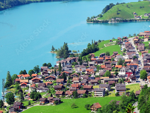 The agricultural and touristic settlement Lungern by the lake of the same name or by the natural reservoir Lungernsee - Canton of Obwalden, Switzerland (Naturstausee Lungernsee oder Lungerensee) photo