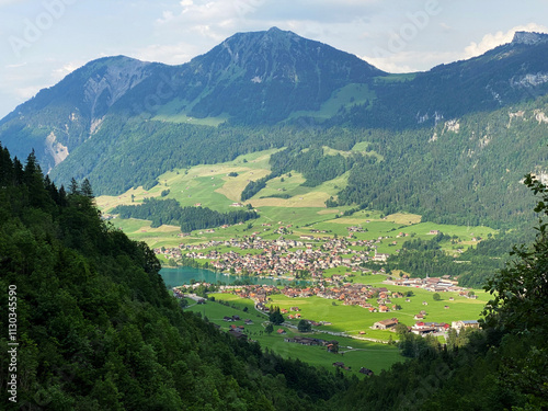 The agricultural and touristic settlement Lungern by the lake of the same name or by the natural reservoir Lungernsee - Canton of Obwalden, Switzerland (Naturstausee Lungernsee oder Lungerensee) photo