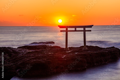 秋の神磯の鳥居と日の出　干潮時　茨城県大洗町　Autumn Kamiiso-no-torii and sunrise. At low tide. Ibaraki Pref, Oarai Town. photo