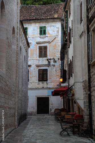 Kotor's narrow cobblestone streets and historic stone houses, a UNESCO World Heritage site. City ​​architecture details.	