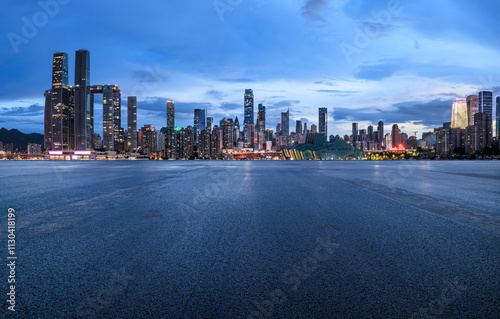 Obraz na płótnie Asphalt road square and city skyline with modern buildings scenery at night in Chongqing, China. Outdoor asphalt parking lot. w salonie