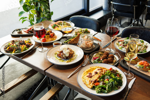 festive table with different gourmet food for a holiday in a cafe or restaurant, top view