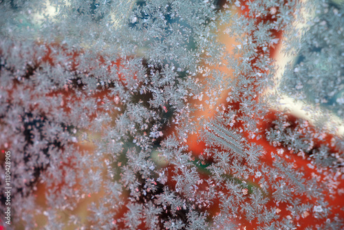 Frozen patterns create beautiful designs on a window in Västanvik, Dalarna during winter