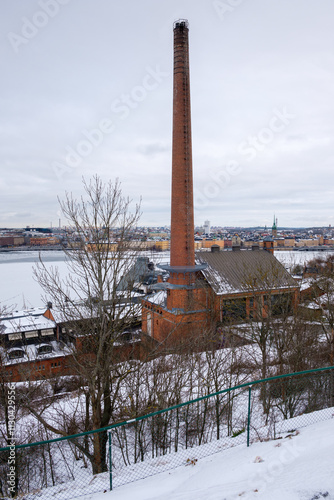 Historic building covered in snow by the waterfront in winter Stockholm, Sweden