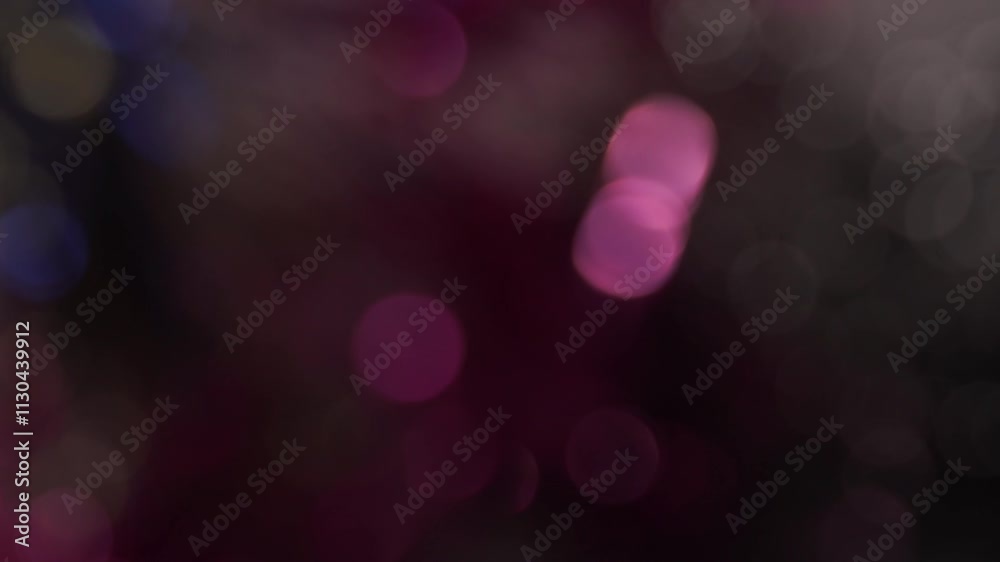 arrière plan animé vidéo autour du mauve avec des billes de bokeh apparaissent en nombre et de couleurs festives de façon lumineuses