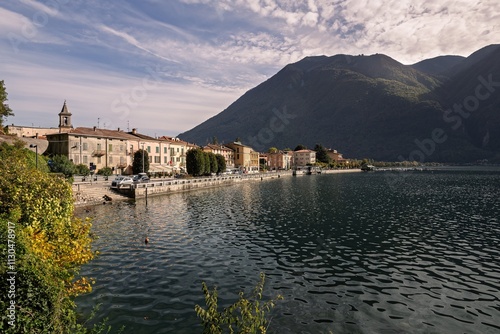 View of Porlezza city in front of Lugano lake during the autumn season photo