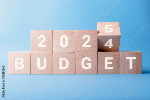 Planning 2025 budget new year symbol. Concept words 2024 Review to 2025 Review on wooden blocks. Business Review 2025 New Year Concept