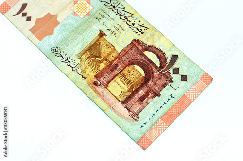 Syrian one hundred pounds issued by central bank of Syria 2009, features Bab el-Hawa or Gate of the wind, the Western Gate built from black basalt stone and The Bosra Amphitheatre photo