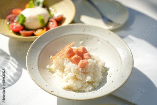 Salmon risotto on a table in a stylish cafe on Jilu Road in Jing'an District, Shanghai, China photo