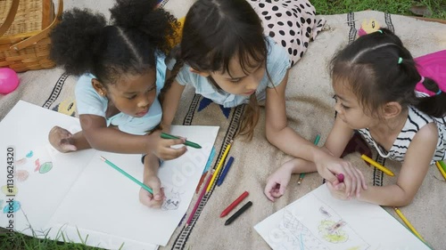 Happy Diverse Kids painting in the garden