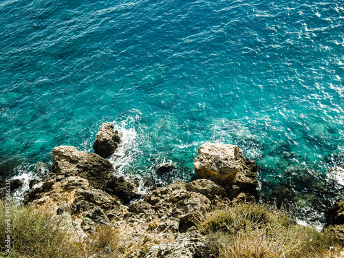 Top view of the sea, amazing nature background. The color of the water and beautifully bright. Azure beach with rocky mountains and clear water Aegean sea on a sunny day. Landscape background photo