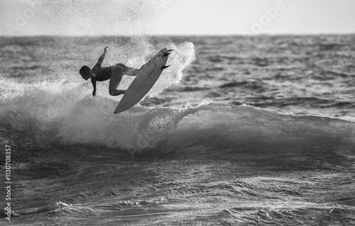 Amazing splash of water of surfer in France photo