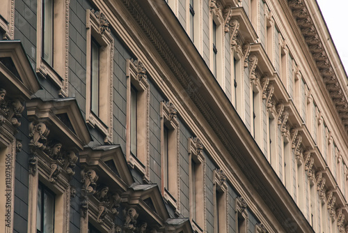 Vienna, Austria - May 12, 2019: Windows in a raw from left to right. Ancient architecture of residential buildings. Elite house, closeup photo of its windows. European architecture of apartments.