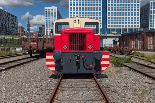 Old diesel train standing in a railway yard in summer, Pasila, Helsinki, Finland. photo