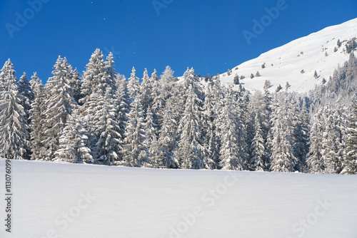 The new deep snow on the wall in the mountains, a walk in the sun and snow. Big panorama wit copy space. photo