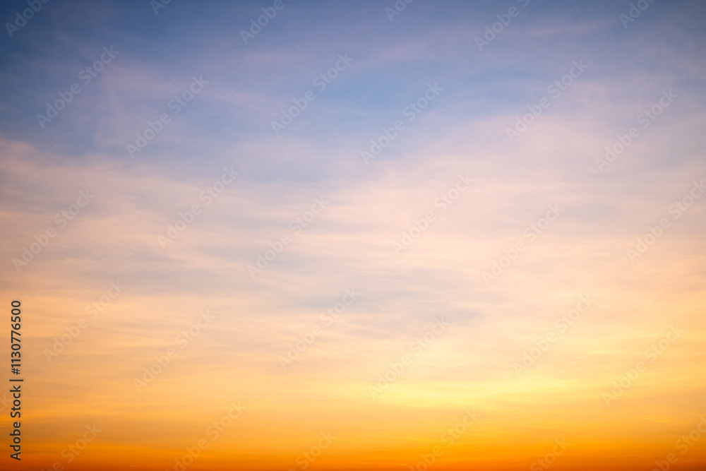 Obraz premium Sky,sunset, beautiful , luxury soft gradient orange gold clouds and sunlight on the blue sky perfect for the background, Sunrise on morning or everning in winter warm time ,Twilight summer,silhouette